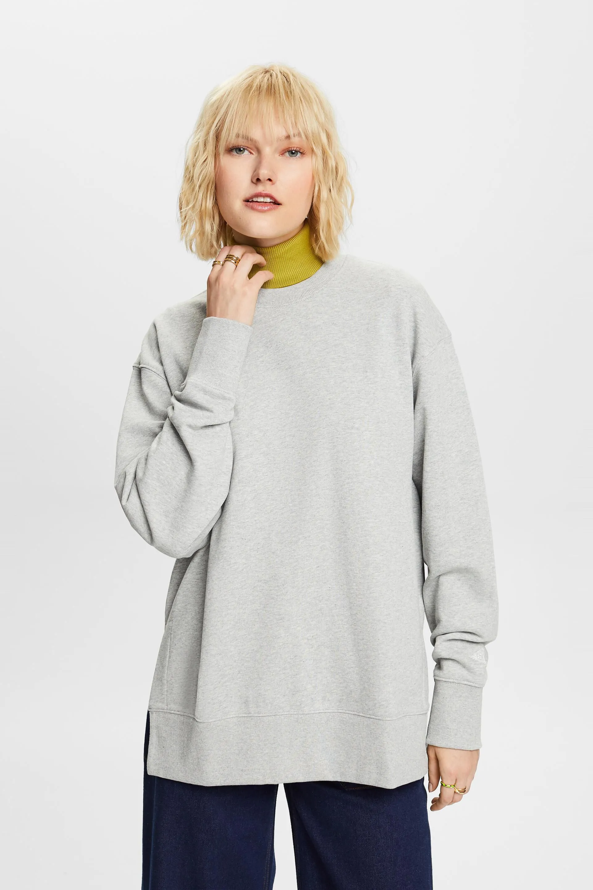 Felpa girocollo oversize con spacchetti sull’orlo
