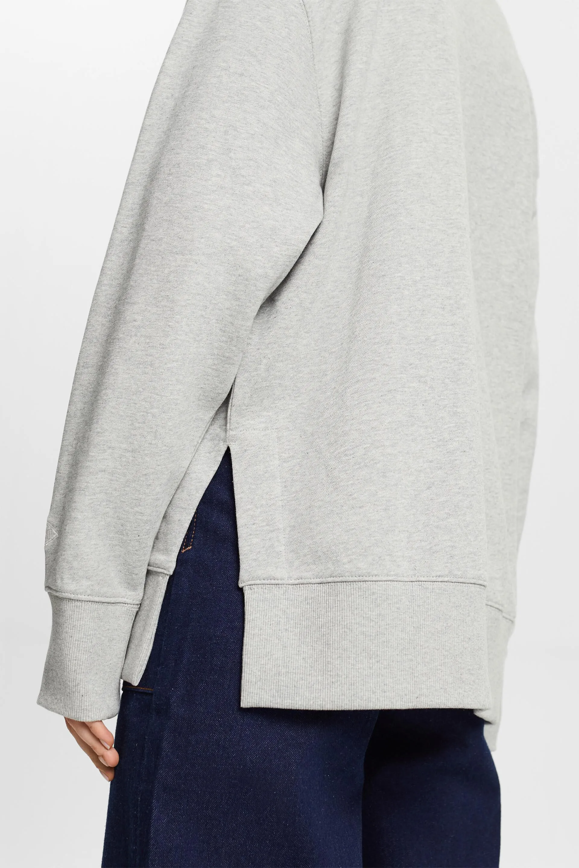 Felpa girocollo oversize con spacchetti sull’orlo