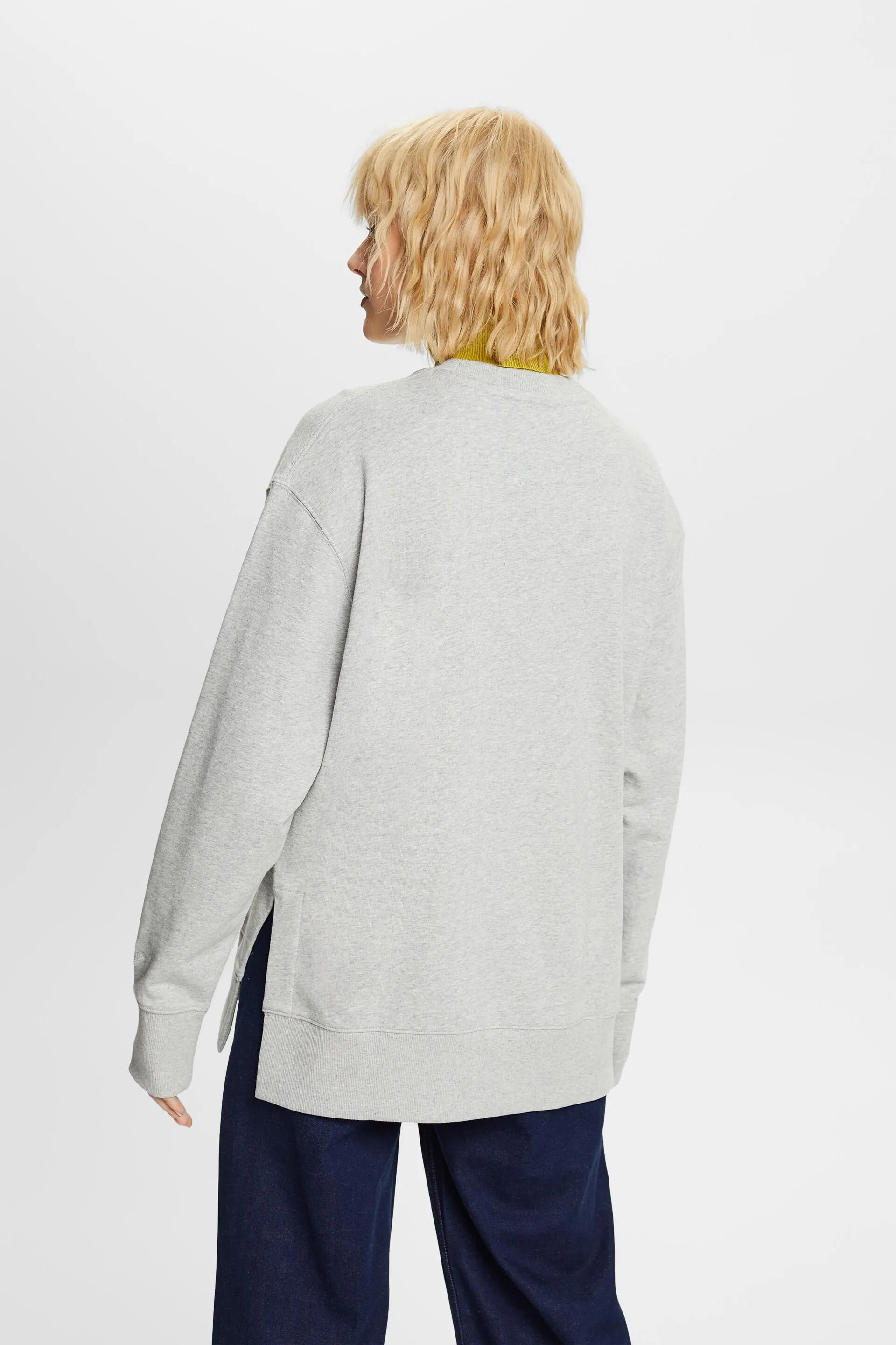 Felpa girocollo oversize con spacchetti sull’orlo