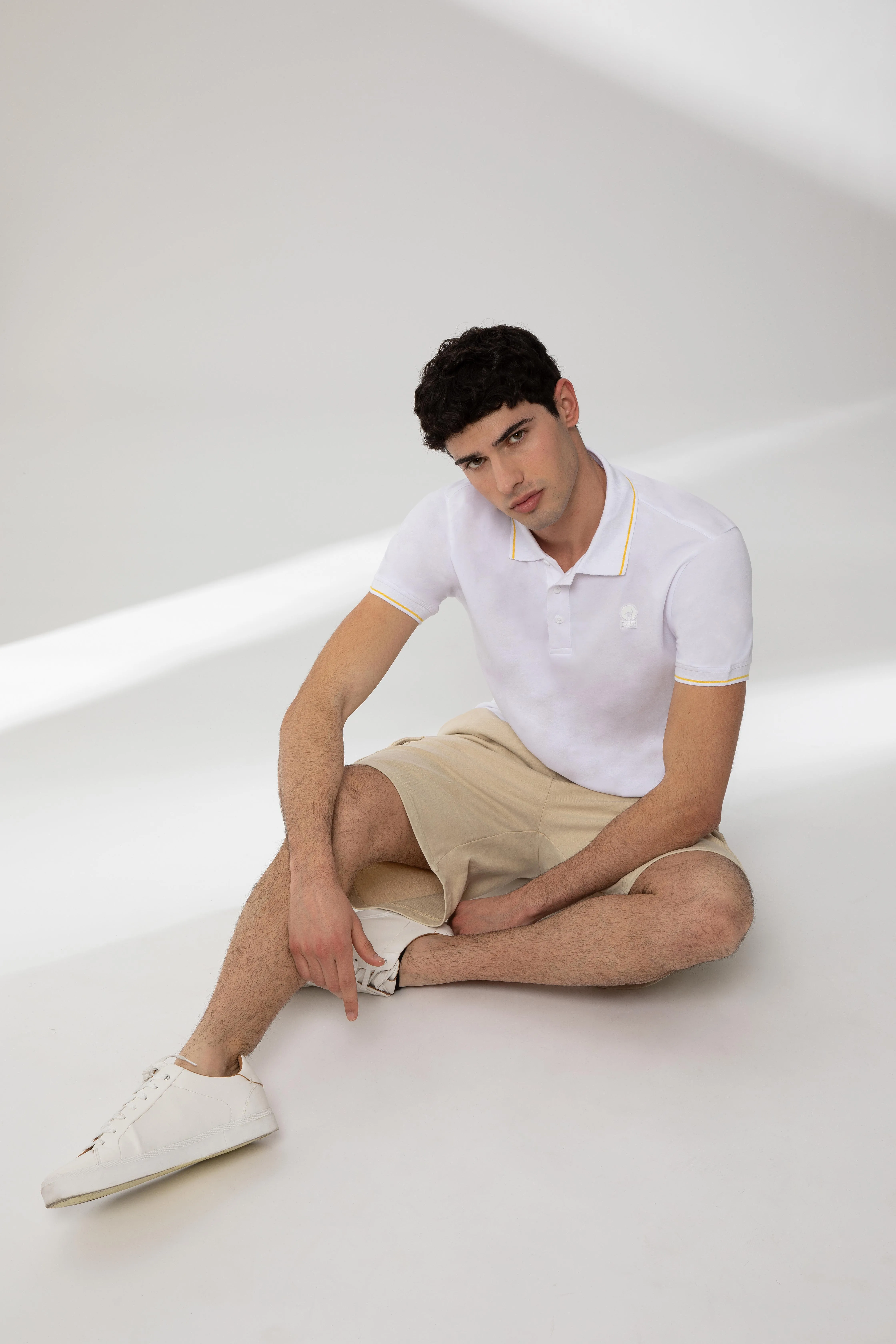SAXON – Polo bianca in cotone stretch